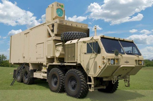 Military directed energy weapon system on heavy vehicle