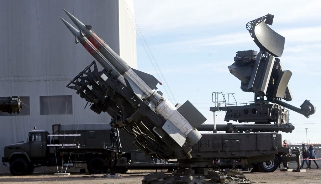 Hawk air defense system on a truck chassis with missiles and radar antenna