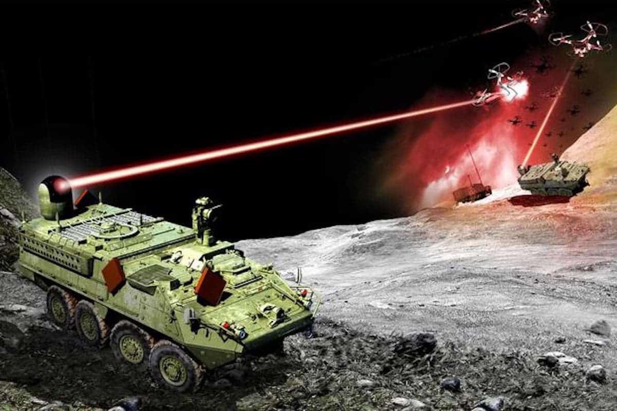 Military vehicle firing a laser beam at an aerial target