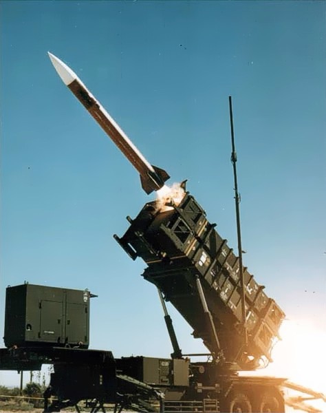 Patriot air defense system firing in coastal Nordic terrain