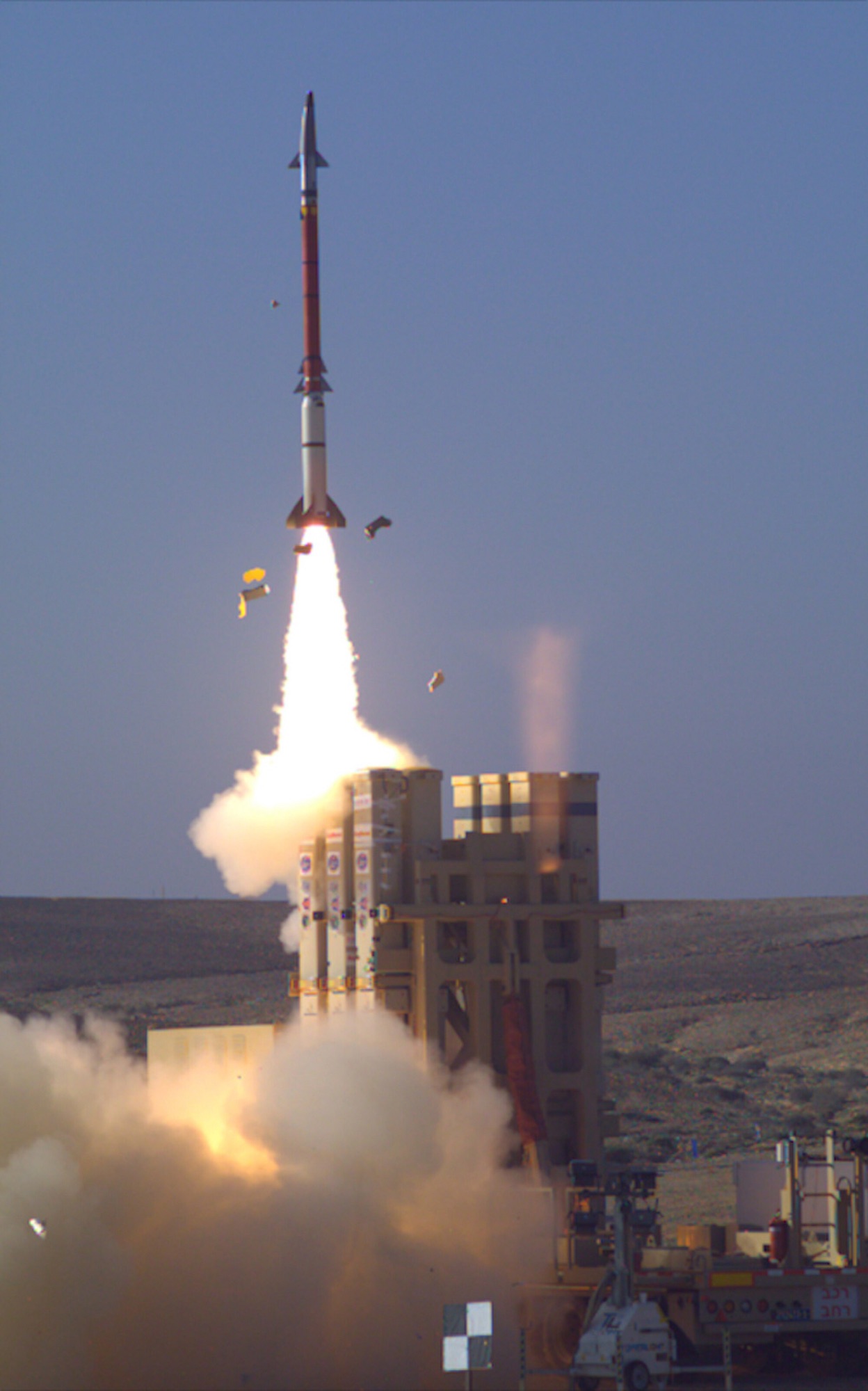 Ballistic missile launch near a building — Middle East theater